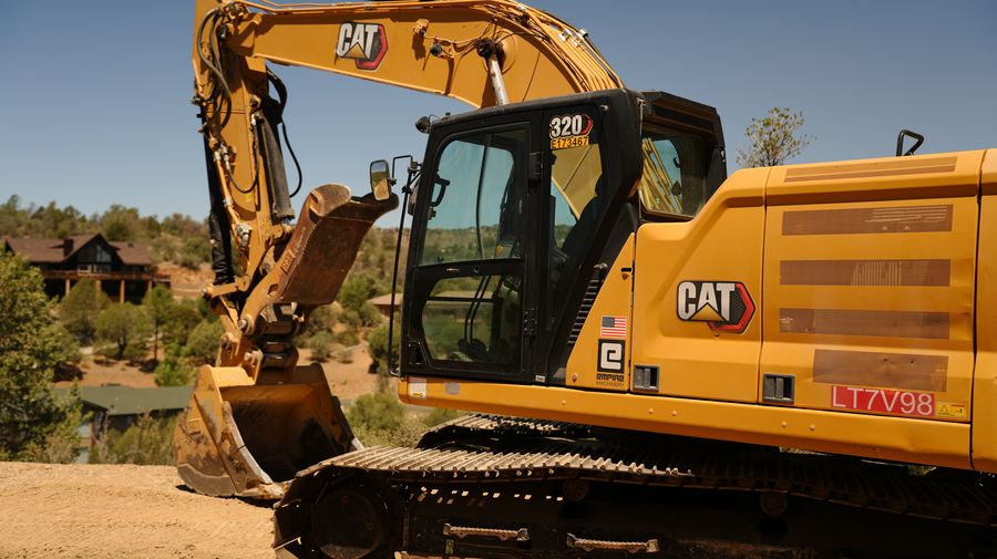 CAT 320 excavator on a graded site in Yavapai County